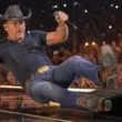 Tim McGraw stage fall performing at Riverbend Music Center concert